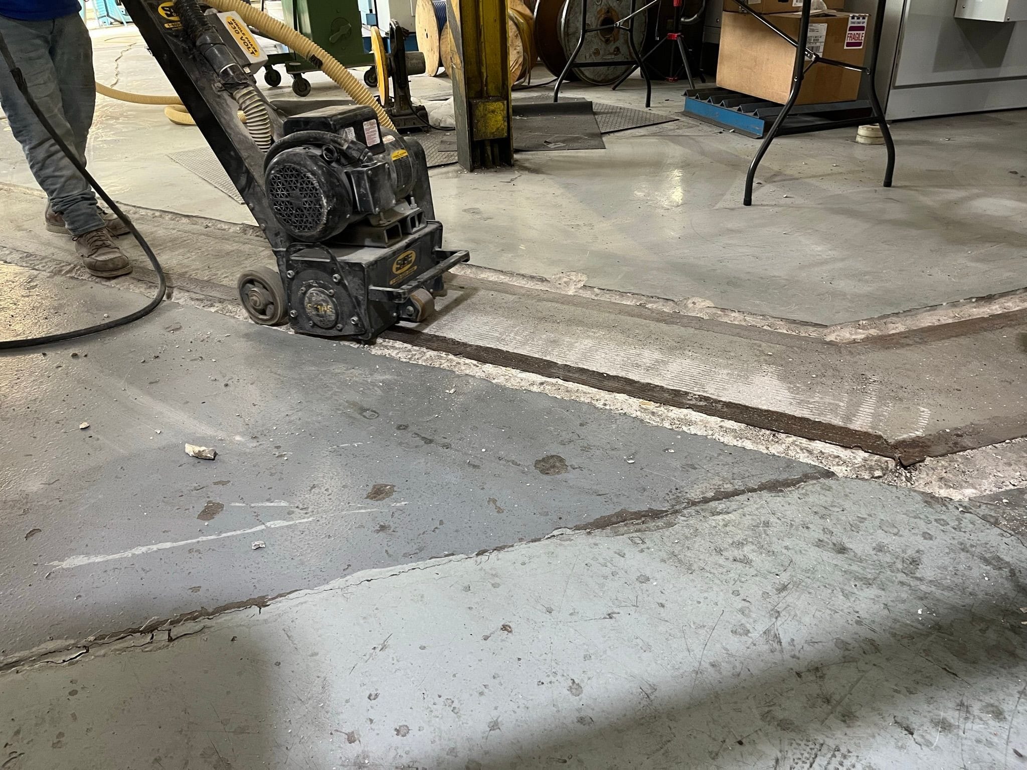 scarifying floor to remove encrusted material