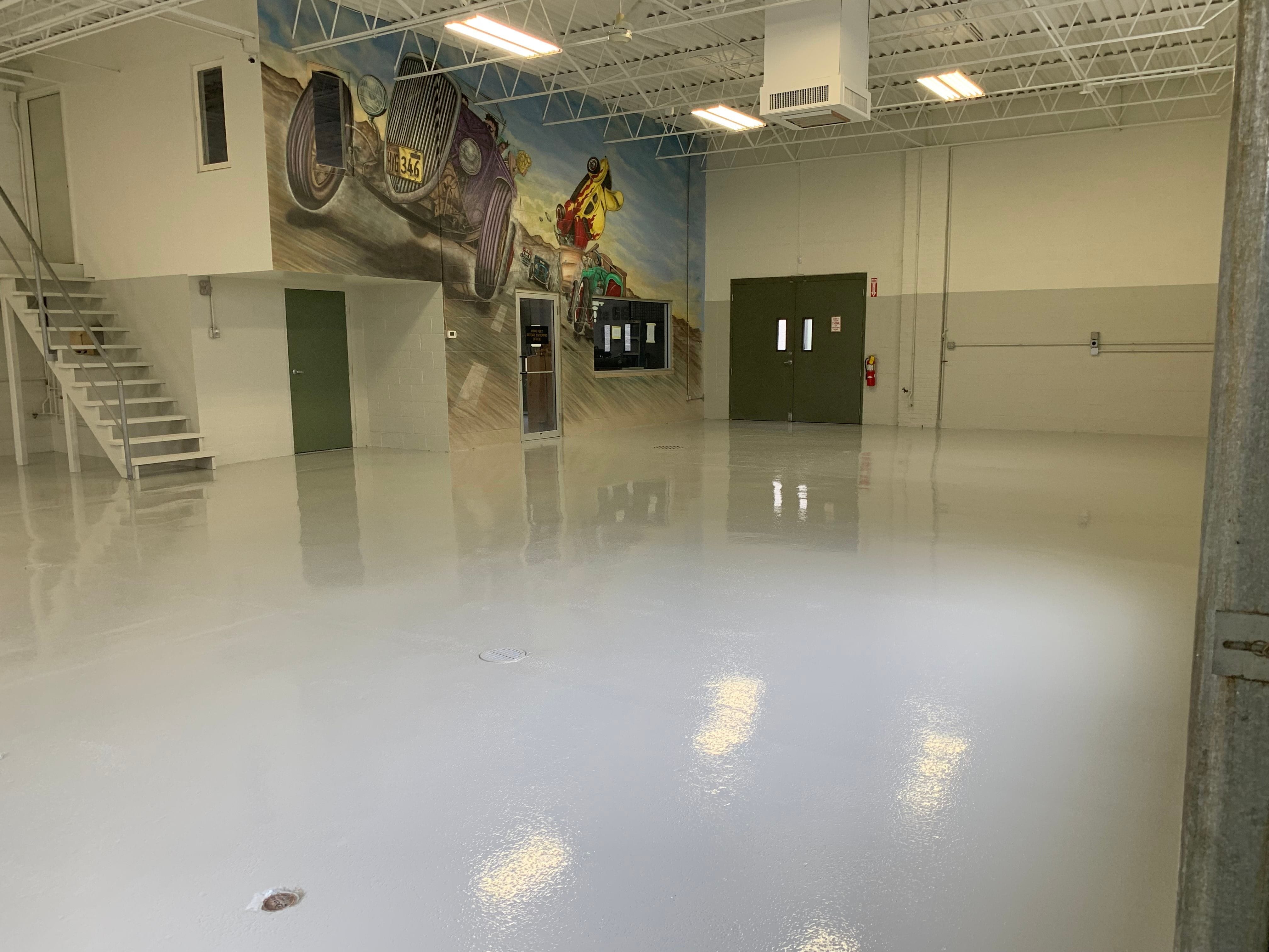 Manufacturing environment with a grey epoxy floor.